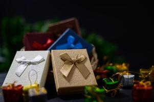 Gift boxes with ribbon and bow on a black background photo