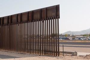 Fence along the US, Mexican border in El Paso, Texas photo