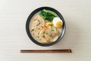 Ramen noodles in pork bone soup with roast pork and egg photo