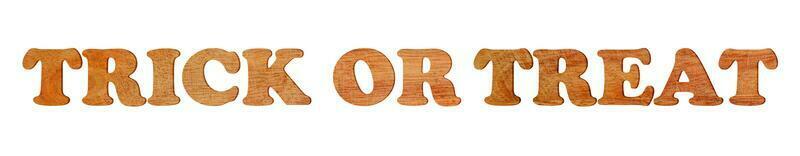 Trick or treat written with wooden letters isolated on white background. photo