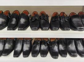 Men's fashion leather shoes on shop window. Concept of diversity, high quality, elegance, honest business relationship photo