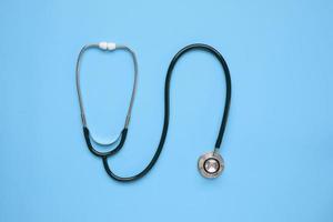 Stethoscope medical equipment on blue background healthcare concept photo