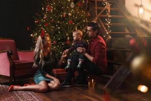 Young happy family are celebrating Christmas or New year. photo