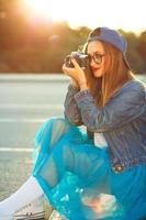 Hipster girl with old camera photo