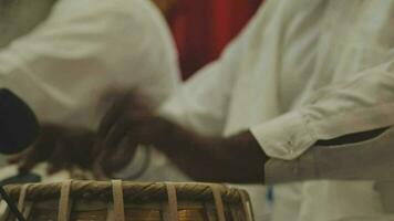 A set of drums being played at an Indian wedding video