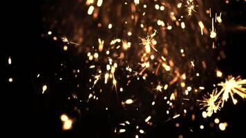 Bright sparks of New Year's fireworks on a black background. High quality FullHD footage. Filmed is slow motion 1000 fps. video