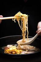 Japanese ramen, soup mix with noodles, meat, eggs and vegetables photo
