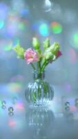 Beautiful pink and green flowers in a vase on a table photo