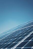 Close up photo of a solar panel against a blue sky background