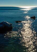 Reflection of the sun in the water in the Black sea, Odessa photo