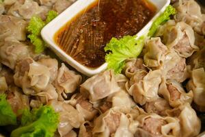 steam siomai with chili sauce photo