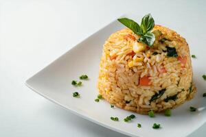 A plate with rice and vegetables on it photo