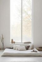 White minimalist bedroom with a low bed, simple decor, and natural light flooding in from a large window photo