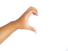 Closeup of male asian hand isolated on white background. Young man forming shape of half of heart with his fingers. Horizontal color photography. Point of view shot with copy space. photo