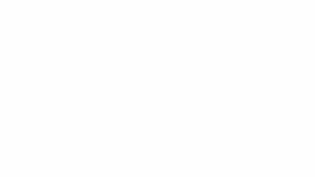 A man is standing in front of a white wall video