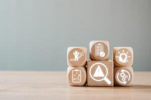 Wooden blocks with icons symbolizing crisis management, strategy, and solutions for business challenges. photo