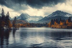 Scenic Lake Reflection of Mountains and Autumn Trees Under Cloudy Sky photo